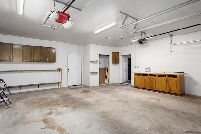  - garage featuring a garage door opener