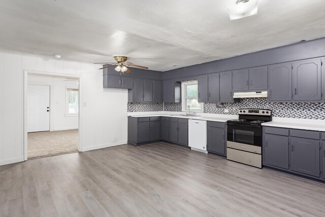  - kitchen featuring electric range oven, under cabinet range hood, a sink, dishwasher, and gray cabinetry