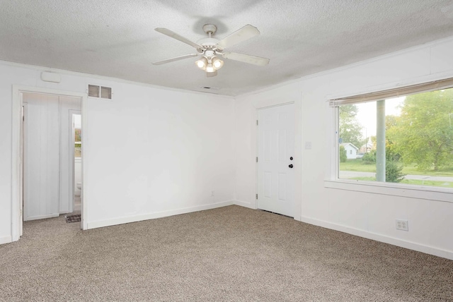  - unfurnished room featuring visible vents, carpet flooring, and a textured ceiling
