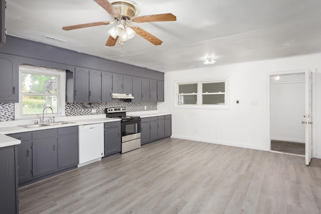  - kitchen featuring gray cabinets, backsplash, dishwasher, a sink, and stainless steel range with electric cooktop