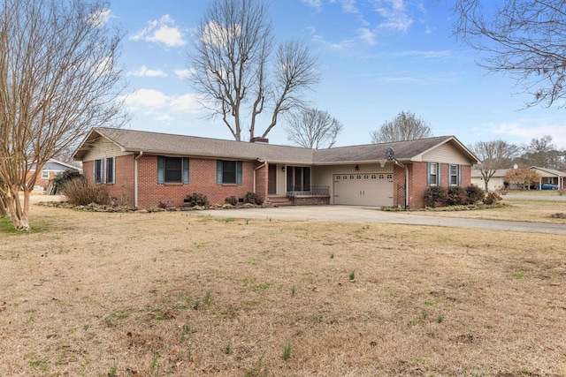 ranch-style house featuring a garage and a front lawn