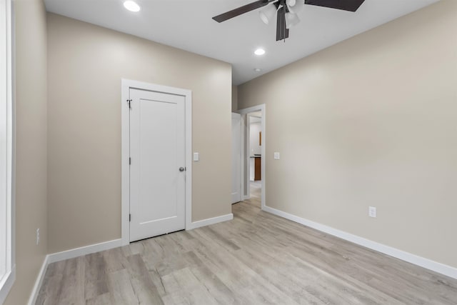 unfurnished room with light hardwood / wood-style floors and ceiling fan