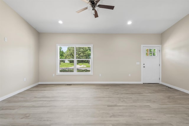 unfurnished room featuring ceiling fan and light hardwood / wood-style flooring