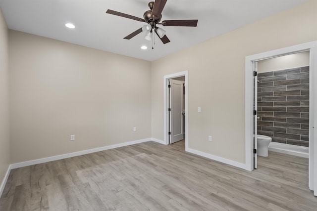 unfurnished bedroom with ensuite bath, ceiling fan, and light hardwood / wood-style floors