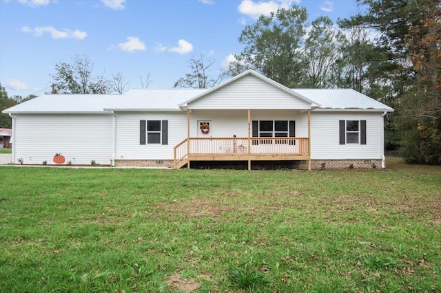 rear view of house with a yard