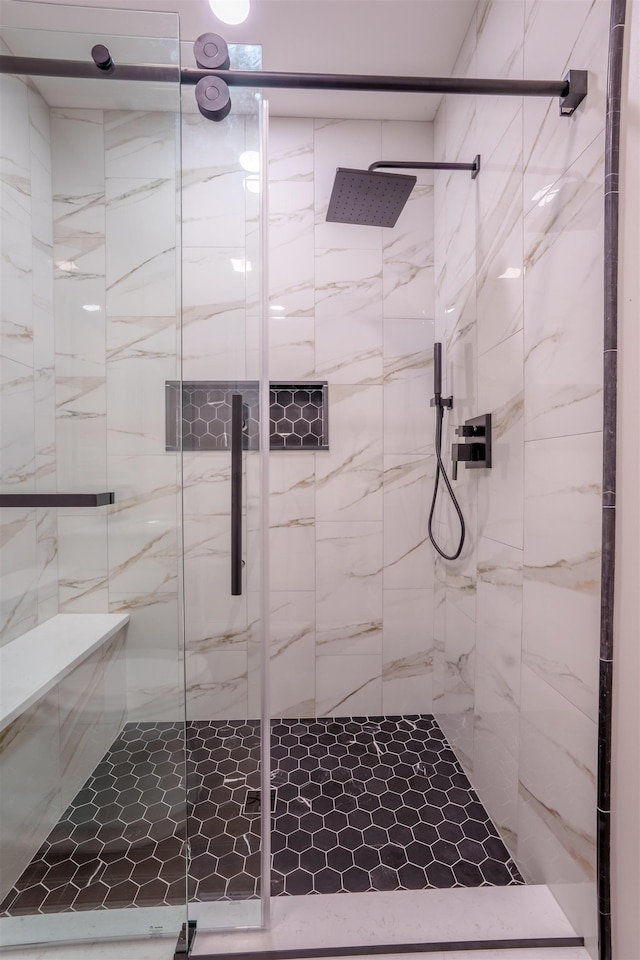 full bath with a shower stall