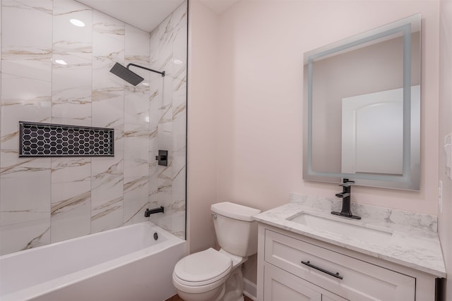 bathroom with toilet, vanity, and shower / washtub combination