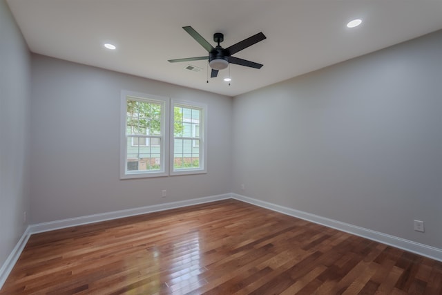 unfurnished room featuring wood finished floors, ceiling fan, baseboards, and recessed lighting