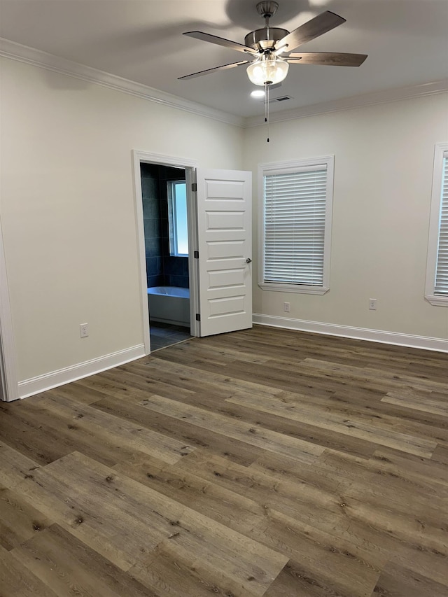 unfurnished room featuring ceiling fan, dark hardwood / wood-style flooring, and ornamental molding