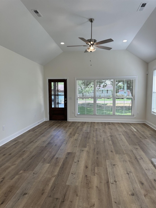 unfurnished living room with ceiling fan, hardwood / wood-style floors, and lofted ceiling