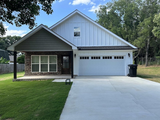 view of front of home featuring a garage and a front yard