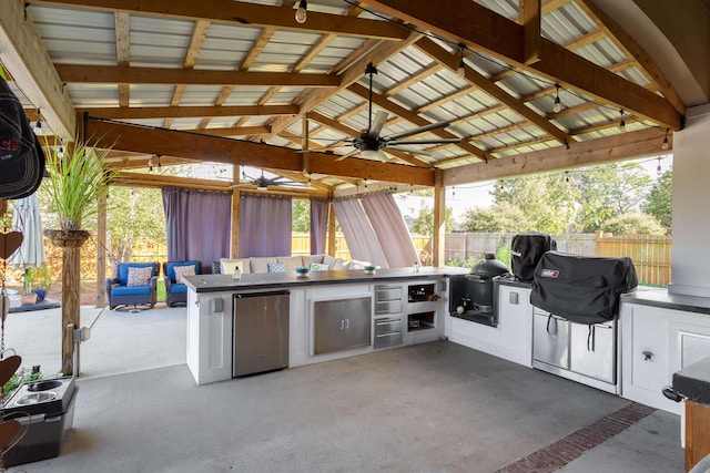 view of patio / terrace featuring a gazebo, area for grilling, and ceiling fan