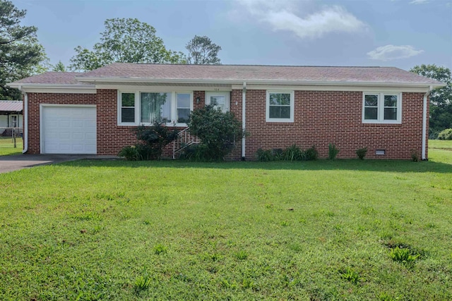 ranch-style house featuring a garage, a front yard, brick siding, driveway, and a shingled roof