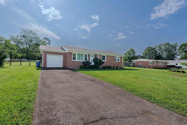 ranch-style house with an attached garage, brick siding, and driveway