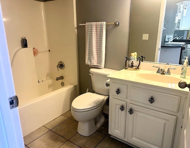 full bathroom with vanity, tile patterned floors, toilet, and shower / washtub combination