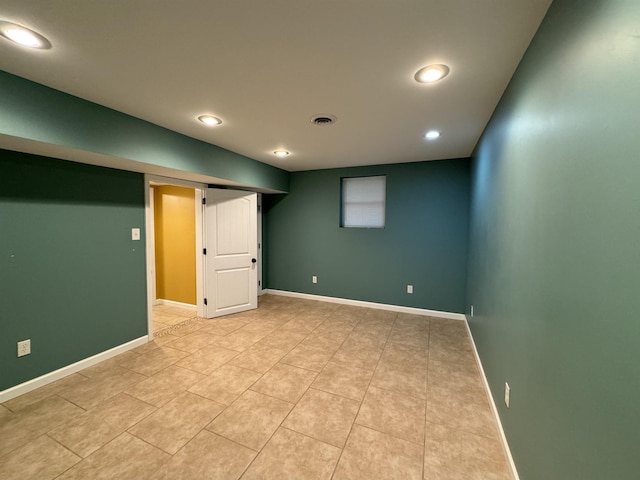 basement with light tile patterned flooring