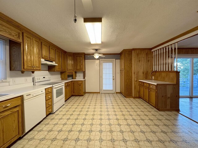 kitchen featuring a textured ceiling, white appliances, decorative light fixtures, and ceiling fan