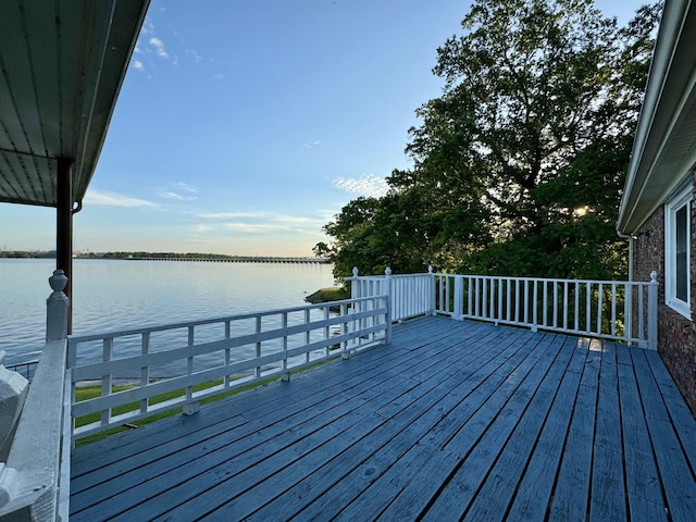 wooden deck featuring a water view