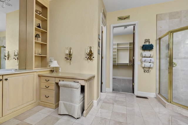  - bathroom with vanity, visible vents, a spacious closet, and a shower stall