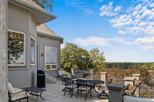  - view of patio / terrace with outdoor dining space and area for grilling
