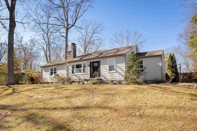 single story home with a front lawn