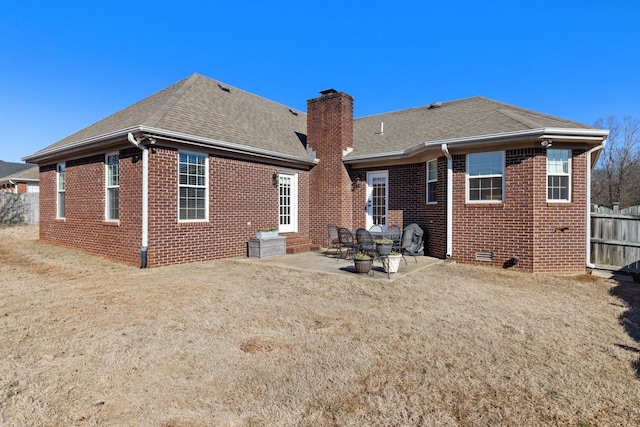 back of house with a patio