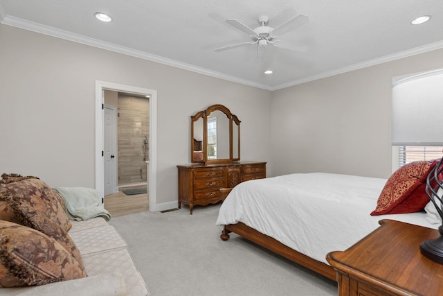 carpeted bedroom featuring multiple windows, crown molding, connected bathroom, and ceiling fan