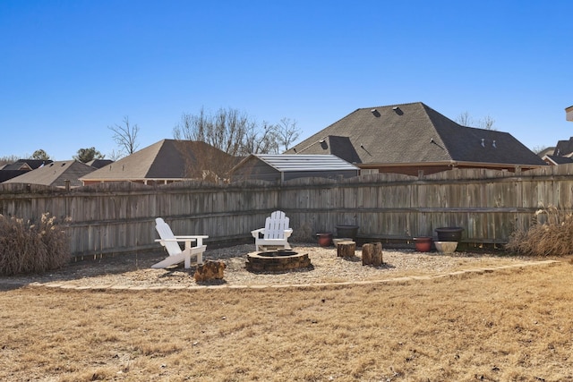 view of yard with a fire pit