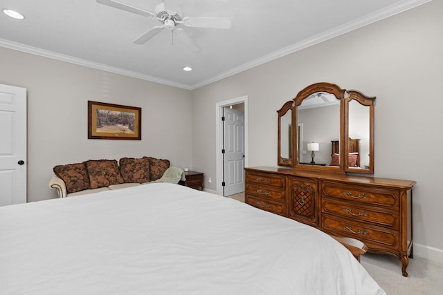 carpeted bedroom featuring ceiling fan and ornamental molding