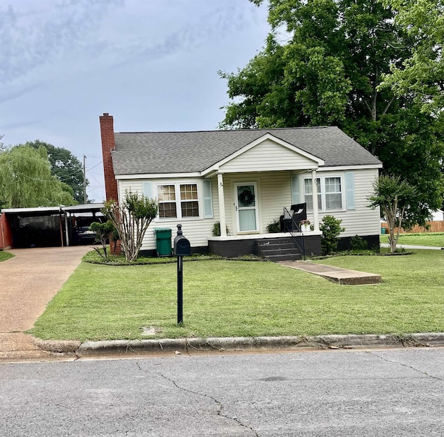 view of front of home with concrete driveway, a chimney, a porch, and a shingled roof