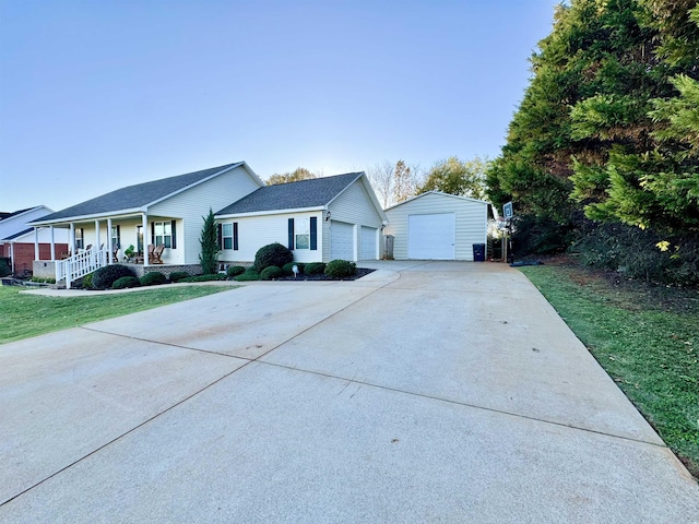 ranch-style house with a porch, a garage, an outdoor structure, and a front yard