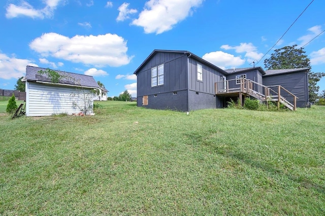 view of yard with stairs and a deck