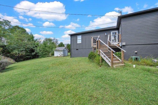 exterior space with a storage unit, stairway, and an outdoor structure