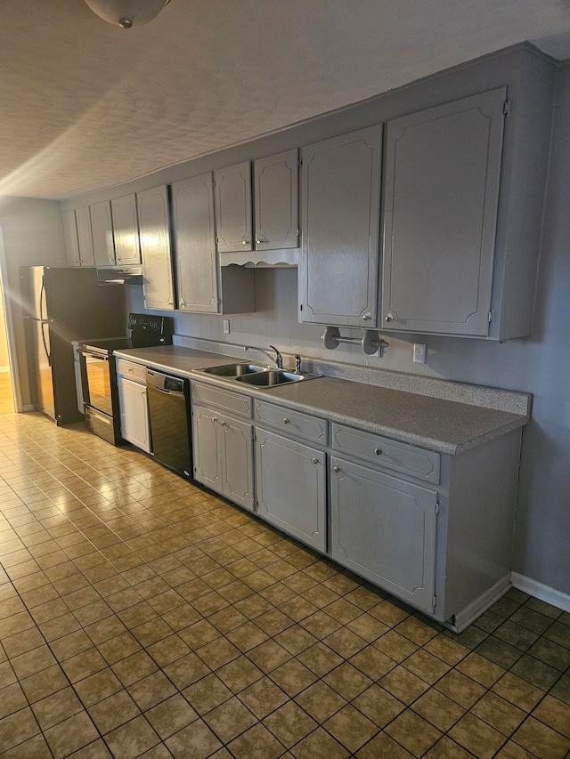 kitchen with black appliances, gray cabinetry, and sink