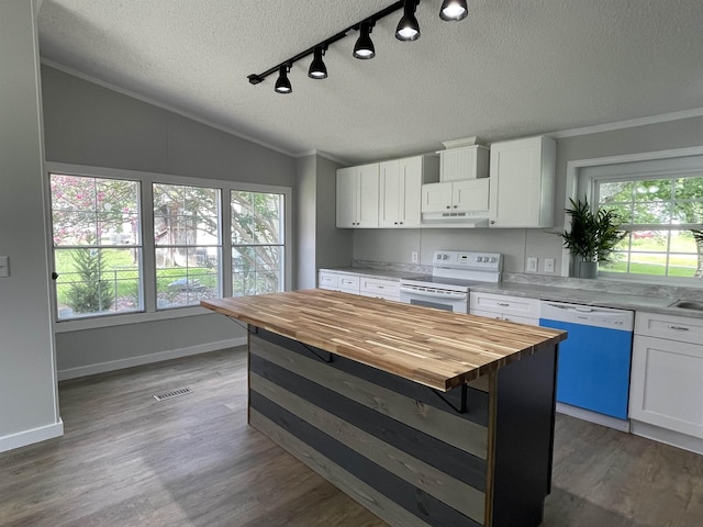 kitchen featuring butcher block countertops, white cabinetry, a textured ceiling, and white appliances