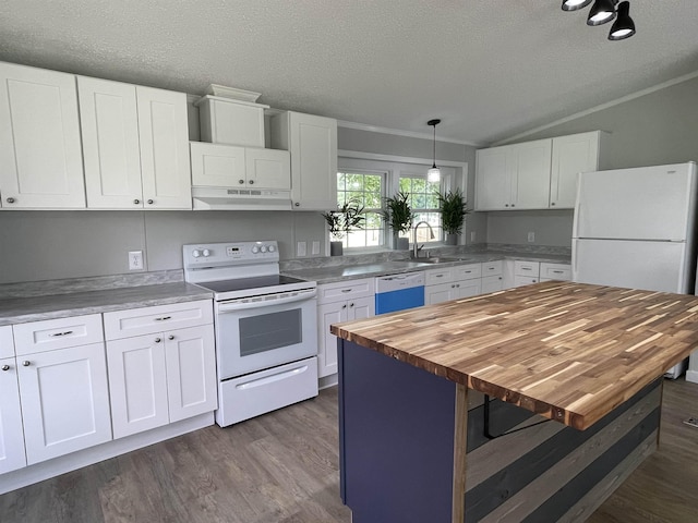 kitchen with white appliances, sink, a center island, white cabinetry, and butcher block counters