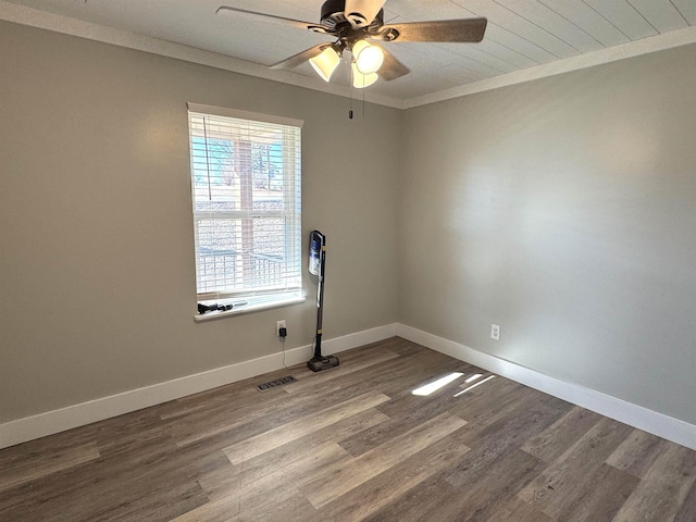 spare room with crown molding, hardwood / wood-style floors, and ceiling fan