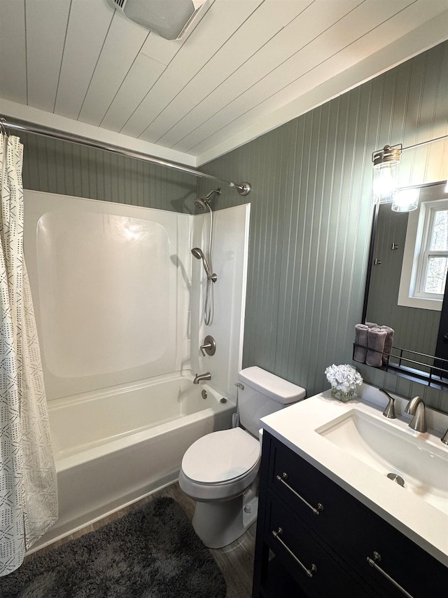 full bathroom featuring shower / tub combo with curtain, wooden walls, vanity, wood ceiling, and toilet