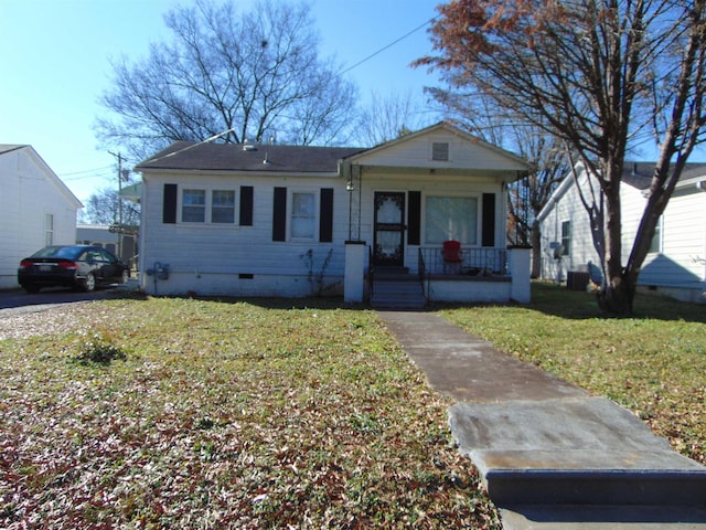 bungalow-style house featuring a porch and a front yard