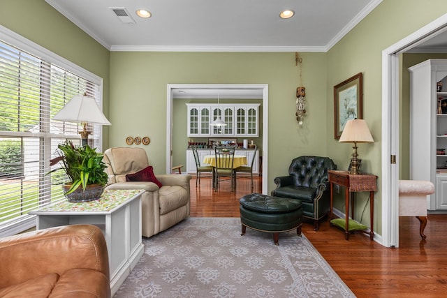  - living room with wood finished floors, ornamental molding, recessed lighting, and baseboards