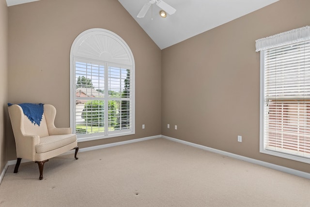 - sitting room featuring carpet, vaulted ceiling, ceiling fan, and baseboards