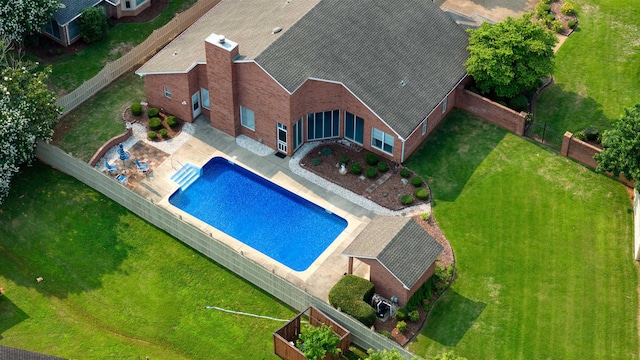  - view of swimming pool featuring a patio area and a fenced backyard