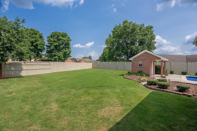  - fenced backyard featuring a patio