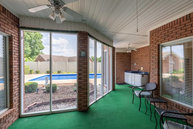  - sunroom / solarium featuring a ceiling fan and plenty of natural light