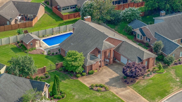  - aerial perspective of suburban area with a pool area