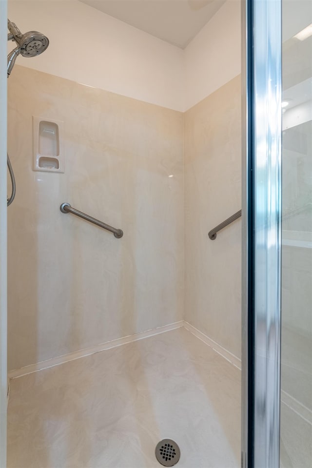  - full bathroom featuring a stall shower