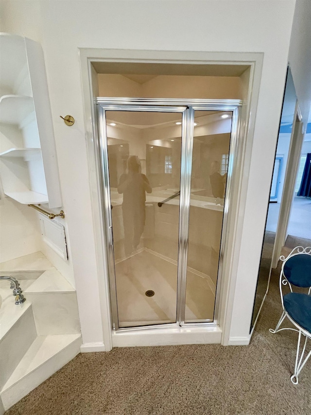  - bathroom featuring a shower stall, a bath, and carpet flooring