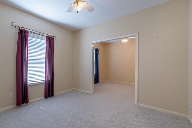  - unfurnished room featuring ceiling fan and light carpet