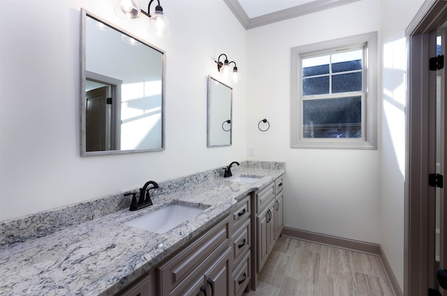 bathroom featuring vanity and ornamental molding