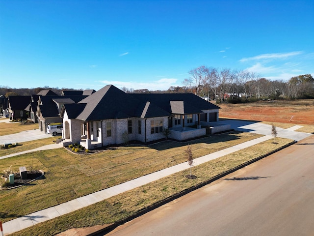 view of front of house with a front yard and a garage